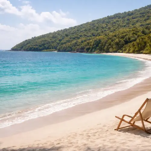 A wide panoramic shot of a crescent-shaped white sand beach with turquoise water and lush green hills in Puerto Rico.
